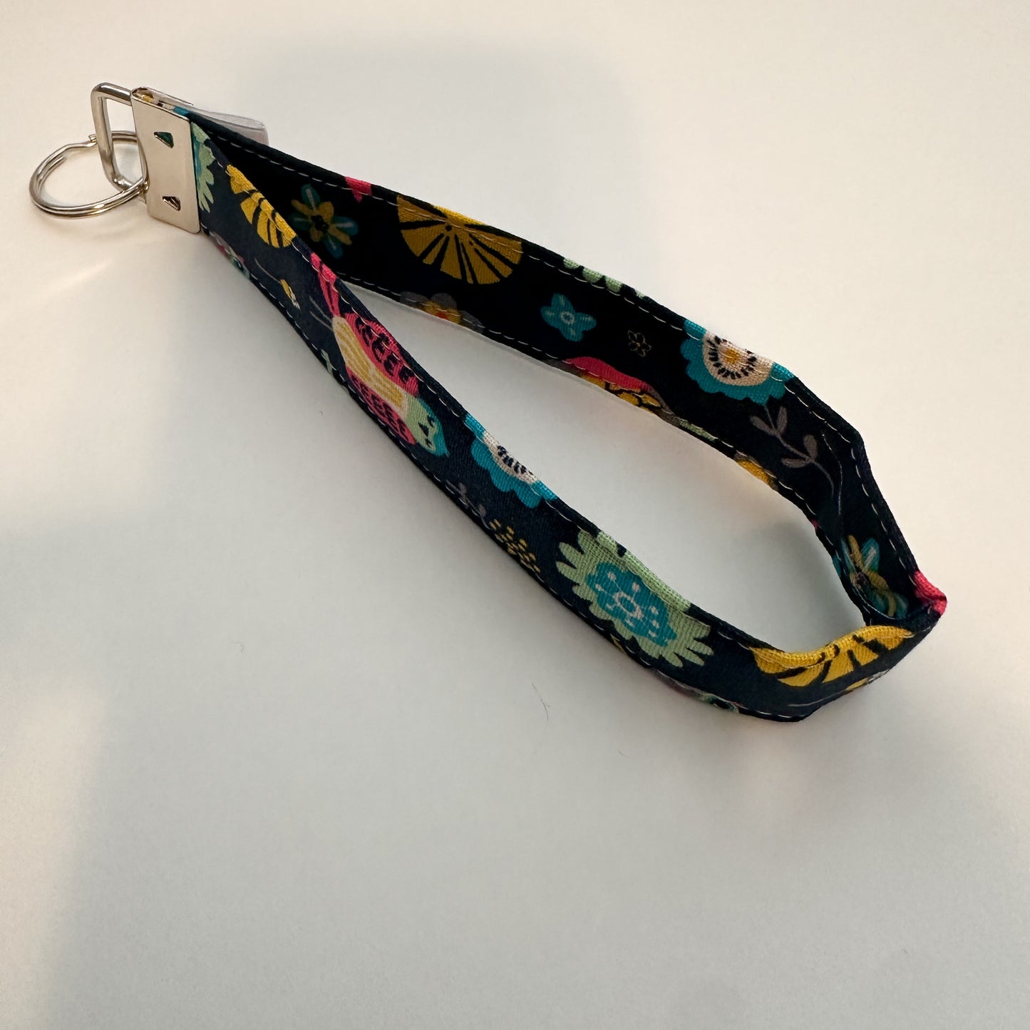 Floral patterned keychain strap on a white background